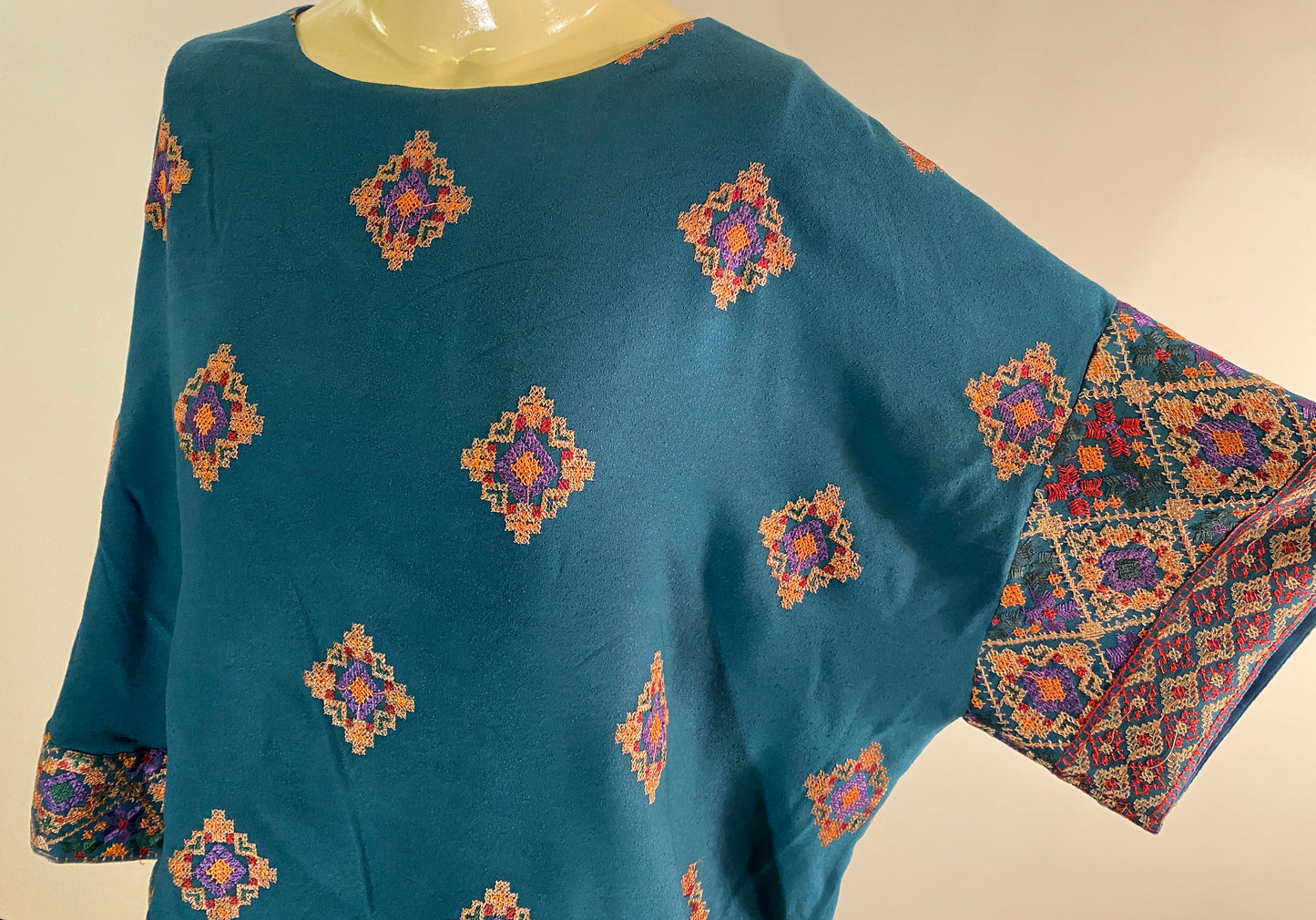 Petal Shawl Shirt in Turquoise Cross Stitch